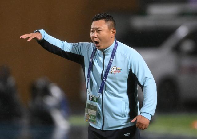 Naegohyang Women's FC head coach Ri Yu Il reacts during the AFC Women's Champions League semi-final football match between North Korea's Naegohyang Women's FC and South Korea's Suwon FC Women in Suwon on May 20, 2026. (Photo by Jung Yeon-je / AFP)