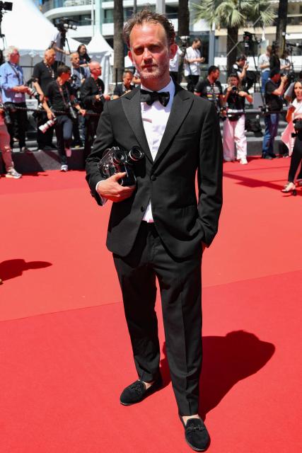 French director and screenwriter Emmanuel Marre arrives for the screening of the film "Notre Salut" (A Man of His Time) at the 79th edition of the Cannes Film Festival in Cannes, southern France on May 20, 2026. (Photo by Olivier CHASSIGNOLE / AFP)
