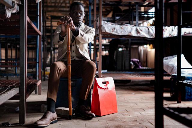 Moses Kibuuka, a senior year student at St. Julian High School, poses for a picture inside his dormitory after dressing up to attend the school’s prom party themed “A Night in Italy” in Gayaza, on May 19, 2026. Uganda’s high school proms, influenced by global youth and celebrity culture and amplified by social media, have become lavish celebrations blending fashion, creativity and status with local styles of celebration. Mostly seen in elite and urban schools, the events feature themed decor, luxury arrivals and elaborate outfits, with some students previously making headlines for arriving by helicopter before the government banned helicopters and luxury SUV's at school events. Schools balance student expression and modern trends with cultural values and stricter government regulations. (Photo by Badru Katumba / AFP)