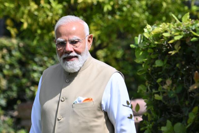 Indian Prime Minister Narendra Modi stands after planting a tree with Italian Prime minister at Villa Doria Pamphili in Rome on May 20, 2026, as the two leaders hold bilateral talks focusing on strengthening India-Italy cooperation. (Photo by Alberto PIZZOLI / AFP)