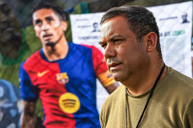Ivo Goncalves, coach and coordinator of Esporte Clube 2014, a social football project attended by Brazilian international football player Raphinha in his youth, poses for a portrait in Viamao, Rio Grande do Sul state, Brazil, on May 15, 2026. (Photo by SILVIO AVILA / AFP)