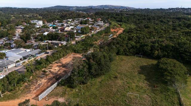 Aerial view of the old Santa Rita football fields, now used as horse pasture, where Brazilian international football player Raphinha trained during his time with Esporte Clube 2014, a social football project, in Viamao, Rio Grande do Sul state, Brazil, on May 16, 2026. (Photo by Silvio AVILA / AFP)