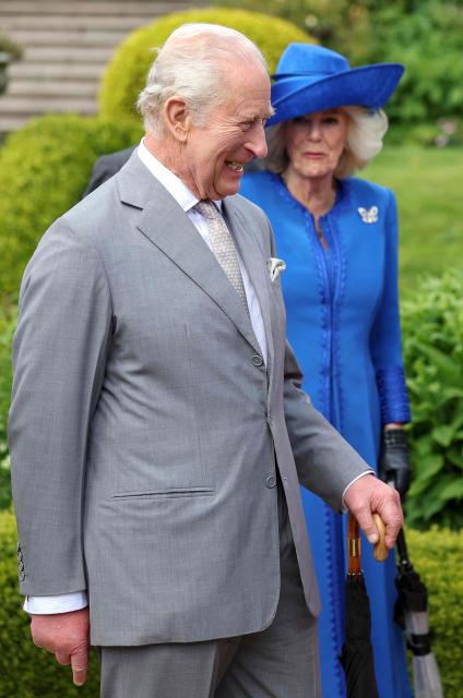Britain's King Charles III and Britain's Queen Camilla attend a Garden Party at Hillsborough Castle, in Hillsborough, Northern Ireland on May 20, 2026, on the second day of a three-day royal visit to Northern Ireland. (Photo by Chris Jackson / POOL / AFP)