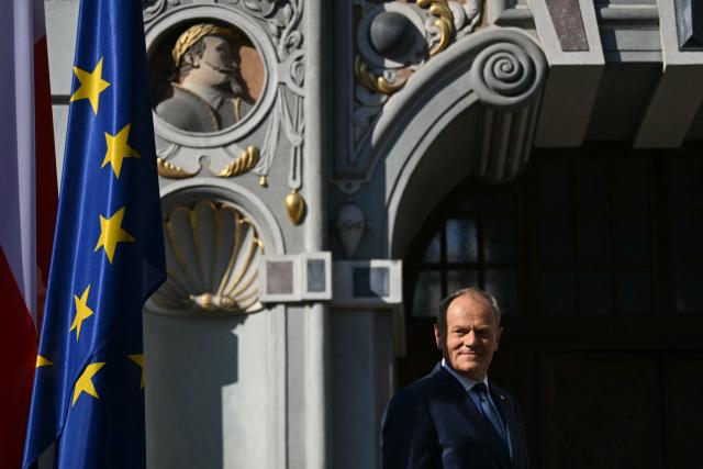 Poland's Prime Minister Donald Tusk looks on to supporters in Gdansk, Poland, on May 20, 2026. Hungary's new Prime Minister Peter Magyar is on a two-day visit to Poland for his first official trip abroad, hoping to mark his country's re-alignment with the European Union after years of open conflict under his predecessor. (Photo by Sergei GAPON / AFP)