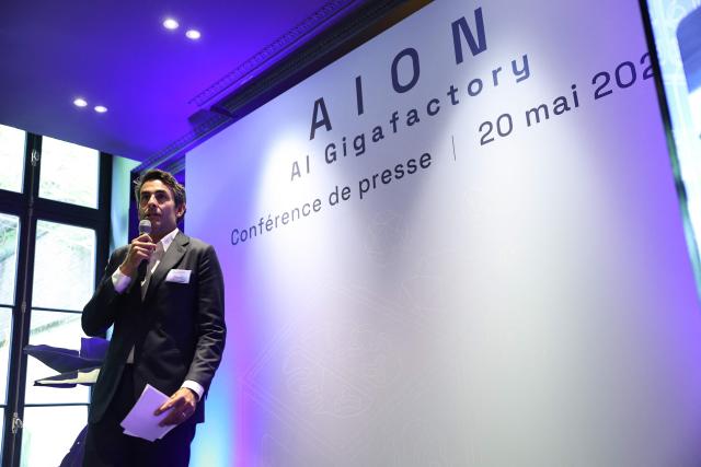 CEO of the Iliad Group Thomas Reynaud speaks during a press conference to announce the creation of a consortium to support the bid for an European AI Gigafactory in France, in Paris on May 20, 2026. Named “AION,” the consortium of 28 companies will submit a French proposal in response to a call for tenders from the European Commission, which is expected to be published shortly, with the aim of creating in Europe a handful of mega computing infrastructure projects that are essential for the development of AI. (Photo by Anne-Christine POUJOULAT / AFP)
