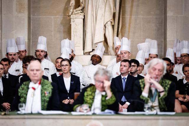 French chef Guy Savoy's team attend his investiture ceremony at the Académie des Beaux-Arts in Paris, on May 20, 2026. (Photo by SIMON WOHLFAHRT / AFP)