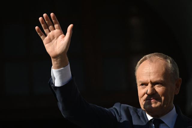 Poland's Prime Minister Donald Tusk greets supporters during a rally in Gdansk on May 20, 2026. Hungary's new Prime Minister Peter Magyar is on a two-day visit to Poland for his first official trip abroad, hoping to mark his country's re-alignment with the European Union after years of open conflict under his predecessor. (Photo by Sergei GAPON / AFP)