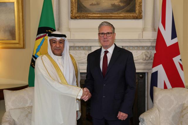 Britain's Prime Minister Keir Starmer (R) meets with Jasem Mohamed Albudaiwi, secretary general of the Gulf Cooperation Council, during their meeting at Downing Street in London on May 20, 2026. (Photo by Adrian DENNIS / POOL / AFP)
