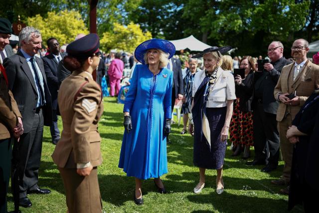 Britain's Queen Camilla (C) attends a garden party at Hillsborough Castle in Hillsborough, Northern Ireland on May 20, 2026, on the second day of a three-day royal visit to Northern Ireland. (Photo by Henry NICHOLLS / POOL / AFP)