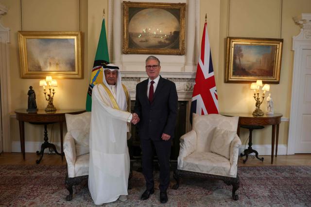 Britain's Prime Minister Keir Starmer (R) meets with Jasem Mohamed Albudaiwi, secretary general of the Gulf Cooperation Council, during their meeting at Downing Street in London on May 20, 2026. (Photo by Adrian DENNIS / POOL / AFP)