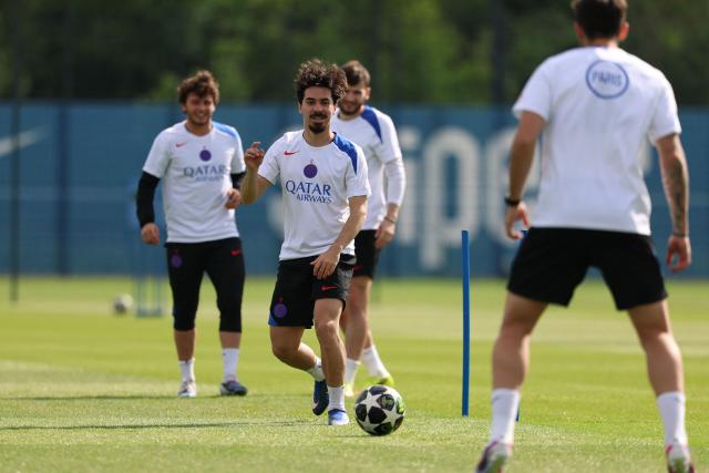 Paris Saint-Germain's Portuguese midfielder #17 Vitinha practices during a training session ahead of their upcoming UEFA Champions League final match against English football club Arsenal FC at the PSG Campus in Poissy, north-west of Paris on May 20, 2026. (Photo by FRANCK FIFE / AFP)