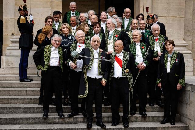 French chef Guy Savoy (C) pose with fellow academy members after his investiture ceremony at the Académie des Beaux-Arts in Paris, on May 20, 2026. (Photo by SIMON WOHLFAHRT / AFP)