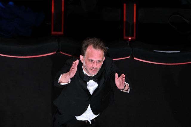French director and screenwriter Emmanuel Marre reacts after the screening of the film "Notre Salut" (A Man of His Time) at the 79th edition of the Cannes Film Festival in Cannes, southern France on May 20, 2026. (Photo by Antonin THUILLIER / AFP)