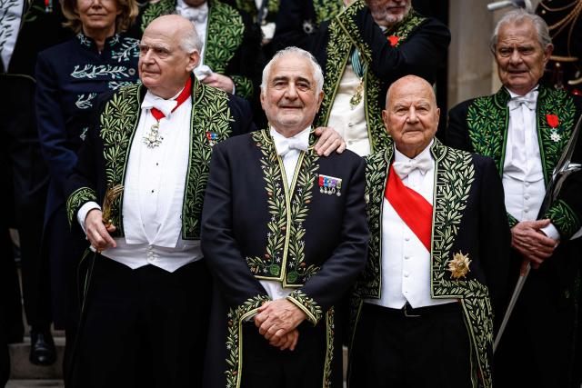 French chef Guy Savoy (C) pose with fellow academy members after his investiture ceremony at the Académie des Beaux-Arts in Paris, on May 20, 2026. (Photo by SIMON WOHLFAHRT / AFP)