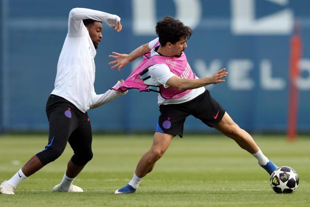 Paris Saint-Germain's French forward #49 Ibrahim Mbaye (L) fights for the ball with Paris Saint-Germain's Portuguese midfielder #17 Vitinha (R) during a training session ahead of their upcoming UEFA Champions League final match against English football club Arsenal FC at the PSG Campus in Poissy, north-west of Paris on May 20, 2026. (Photo by FRANCK FIFE / AFP)