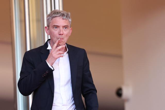 French actor Swann Arlaud leaves after the screening of the film "Notre Salut" (A Man of His Time) at the 79th edition of the Cannes Film Festival in Cannes, southern France on May 20, 2026. (Photo by Sameer AL-DOUMY / AFP)