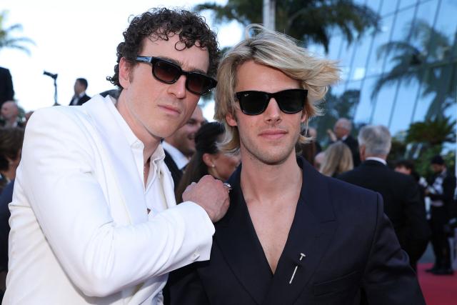 Members of the Ofenbach DJ group Cesar de Rummel and Dorian Lauduique arrive for the screening of the film "La Bataille de Gaulle : L'age de fer" (De Gaulle: Tilting Iron) at the 79th edition of the Cannes Film Festival in Cannes, southern France on May 20, 2026. (Photo by Valery HACHE / AFP)
