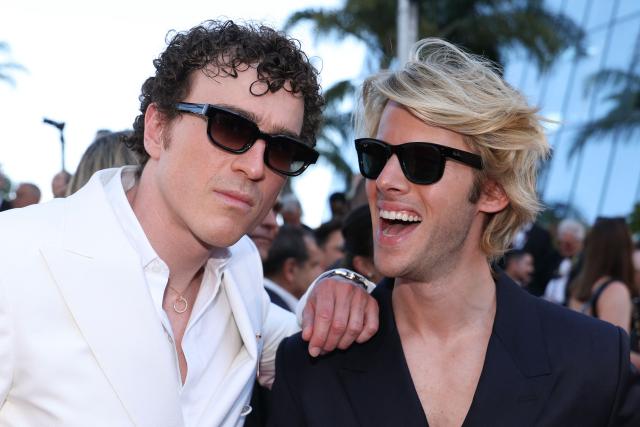 Members of the Ofenbach DJ group Cesar de Rummel and Dorian Lauduique arrive for the screening of the film "La Bataille de Gaulle : L'age de fer" (De Gaulle: Tilting Iron) at the 79th edition of the Cannes Film Festival in Cannes, southern France on May 20, 2026. (Photo by Valery HACHE / AFP)