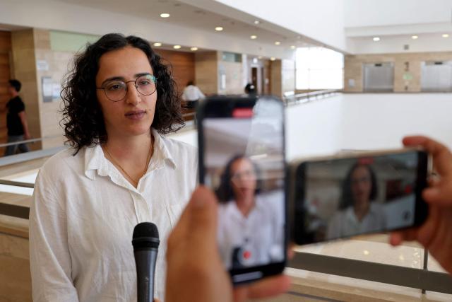 Hadeel Abu Saleh, lawyer at Adalah - The Legal Centre for Arab Minority Rights in Israel, who represents Israeli activist Zohar Chamberlain Regev, member of a flotilla bound for Gaza and one of dozens of activists that were detained when the flotilla was intercepted by Israeli forces, speaks as her client appears at the Ashkelon Trial Court in Ashkelon in southern Israel on May 21, 2026. (Photo by Jack GUEZ / AFP)