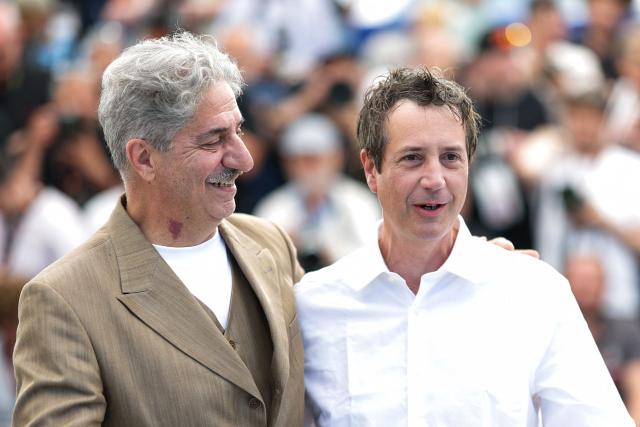 French-Armenian actor Simon Abkarian and French director and screenwriter Antonin Baudry  pose during a photocall of the film "La Bataille de Gaulle : L'age de fer" (De Gaulle: Tilting Iron) at the 79th edition of the Cannes Film Festival in Cannes, southern France on May 21, 2026. (Photo by Sameer AL-DOUMY / AFP)