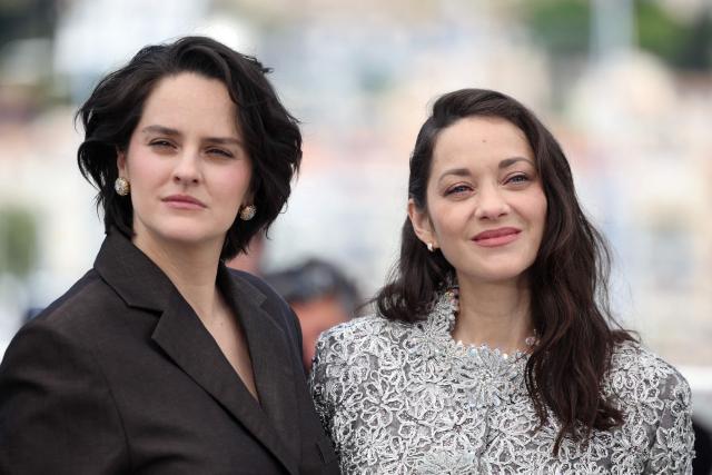 French actress Noemie Merlant and French actress Marion Cotillard pose during a photocall of the film "Roma Elastica" at the 79th edition of the Cannes Film Festival in Cannes, southern France on May 21, 2026. (Photo by Valery HACHE / AFP)