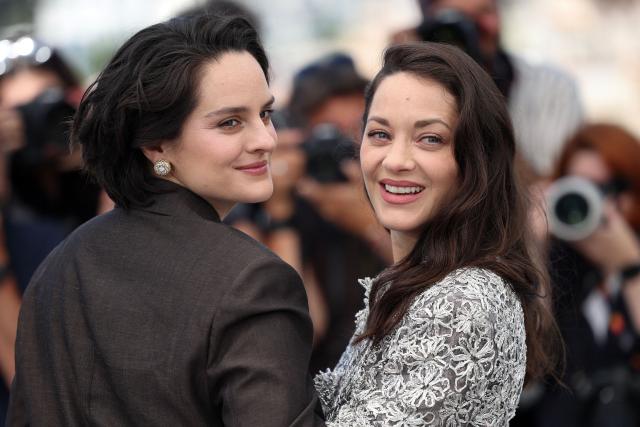 French actress Noemie Merlant and French actress Marion Cotillard pose during a photocall of the film "Roma Elastica" at the 79th edition of the Cannes Film Festival in Cannes, southern France on May 21, 2026. (Photo by Valery HACHE / AFP)