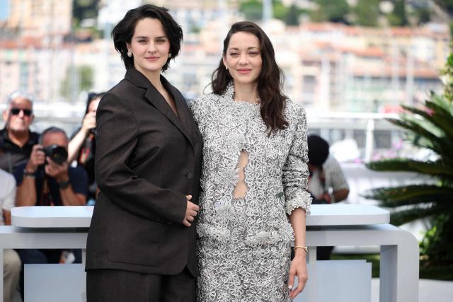 French actress Noemie Merlant and French actress Marion Cotillard pose during a photocall of the film "Roma Elastica" at the 79th edition of the Cannes Film Festival in Cannes, southern France on May 21, 2026. (Photo by Valery HACHE / AFP)