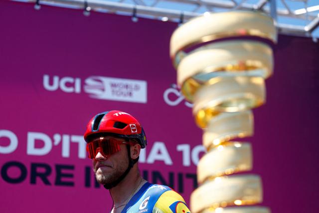 Lidl - Trek Italian rider Jonathan Milan walks past the Giro d'Italia trophy ("trofeo senza fine") as he prepares to compete in the 12th stage of the Giro d'Italia 2026 - Tour of Italy cycling race between Imperia and Novi Ligure, Italy, on May 21, 2026. (Photo by Luca Bettini / AFP)