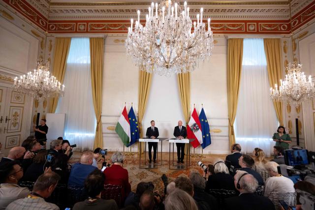 Austrian Chancellor Christian Stocker (R) and Hungarian Prime Minister Peter Magyar speak at a press conference during their meeting in Vienna, Austria, on May 21, 2026. (Photo by Joe Klamar / AFP)