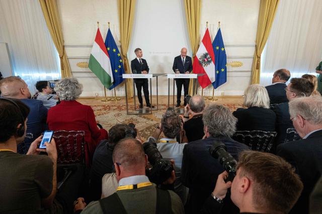 Austrian Chancellor Christian Stocker (R) and Hungarian Prime Minister Peter Magyar address a press conference during their meeting in Vienna, Austria, on May 21, 2026. (Photo by Joe Klamar / AFP)