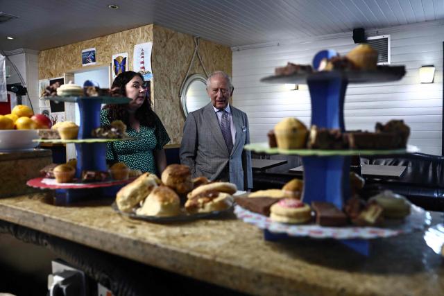 Britain's King Charles III reacts as he looks at locally produced goods during a visit to The Warehouse, in Newtownards, Northern Ireland on May 21, 2026, on the final day of a three-day royal visit to Northern Ireland. Housed in a former pub, The Warehouse has been transformed into a lively and welcoming community hub, offering vital support through free food supplies, hot and take-home meals, skills classes, and access to free clothing and household essentials. (Photo by Henry NICHOLLS / POOL / AFP)