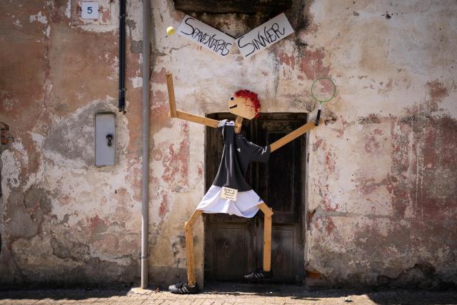 A scarecrow is displayed during a "Scarecrows Fair" in Castellar, near Cuneo, northern Italy on May 21, 2026.  During the annual fair, citizens prepare their own scarecrow and put them in the gardens, courtyards, fields and streets. (Photo by MARCO BERTORELLO / AFP)