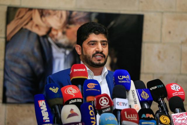 Houthi major general Yahya al-Ruzami, head of the military negotiating committee, holds a press conference upon his arrival at Sanaa International Airport on May 21, 2026, following negotiations in Jordan on the release of conflict-related prisoners. Yemen's warring parties agreed last week to release a total of 1,600 conflict-related prisoners during a UN-sponsored meeting in Amman. The agreement between the Iran-backed Houthi rebels, who control Yemen's north, and the Saudi-supported internationally recognised government comes despite high tensions between Tehran and Riyadh over the war in the Middle East. (Photo by Mohammed HUWAIS / AFP)