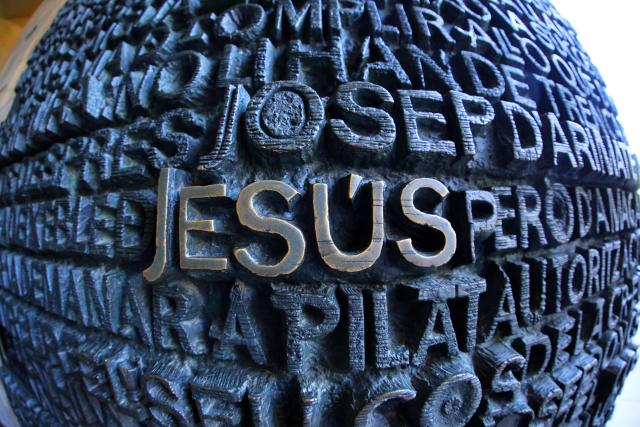 Words are seen on one of the doors of the Sagrada Familia basilica taken with a fisheye lens on May 21, 2026 in Barcelona. The Sagrada Familia basilica's central tower's cross crowns the world's tallest church at 172.5 meters, a temple conceived by Antoni Gaudi more than 140 years ago. (Photo by Thomas COEX / AFP)