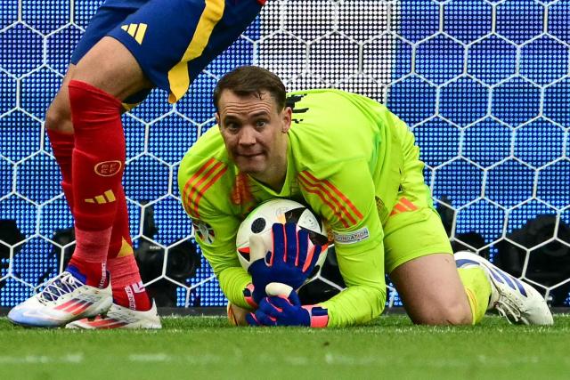 (FILES) Germany's goalkeeper #01 Manuel Neuer holds the ball during the UEFA Euro 2024 quarter-final football match between Spain and Germany at the Stuttgart Arena in Stuttgart on July 5, 2024. Germany's head coach Julian Nagelsmann announced the return of Manuel Neuer to the German squad for the 2026 World Cup, on May 21, 2026. The tournament will take place from June 11 to July 19, 2026 in Mexico, Canada and the US. (Photo by Tobias SCHWARZ / AFP)