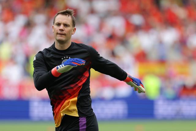 (FILES) Germany's goalkeeper #01 Manuel Neuer warms up ahead of the UEFA Euro 2024 quarter-final football match between Spain and Germany at the Stuttgart Arena in Stuttgart on July 5, 2024. Veteran goalkeeper Manuel Neuer was handed a surprise recall to Germany's 26-man World Cup squad on May 21, 2026, coming out of international retirement to play in the tournament for a fifth time. (Photo by LLUIS GENE / AFP)