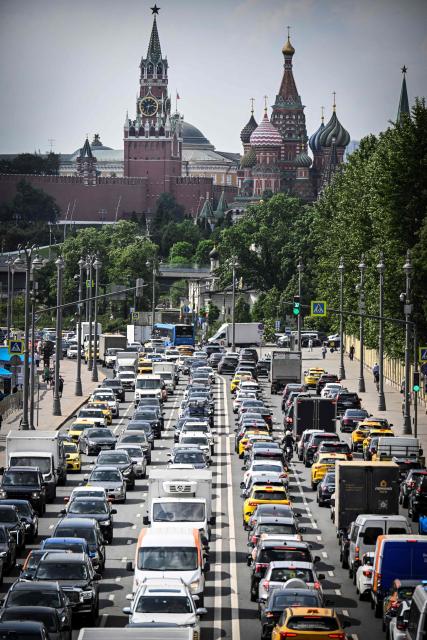 Cars stuck in a traffic jam in central Moscow on May 21, 2026 in front of the Kremlin and St. Basil's Cathedral. (Photo by Alexander NEMENOV / AFP)
