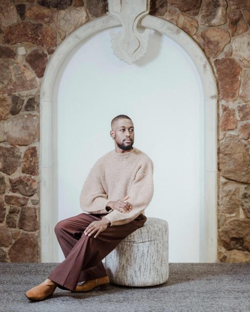 South African painter and multimedia artist Kamohelo Blessing Rooi, 25, poses for a portrait ahead of the opening of the 2026 edition of the RMB Latitudes Art Fair, at the  Shepstone Gardens in Johannesburg, on May 21, 2026. (Photo by MARCO LONGARI / AFP)
