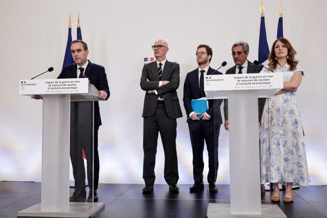 France's Prime Minister Sebastien Lecornu speaks as (from 2nd L) France's Economy, Finances and Industry Minister Roland Lescure, Frances junior Minister for Public Accounts David Amiel, France's Trade Minister Serge Papin and France's Government Spokesperson and junior Minister for Energy and Digital economy Maud Bregeon listen, during a press conference focusing on the consequences of the war in Iran and to announce "measures to support economic activity", at the Hotel Matignon Prime minister residence in Paris on May 21, 2026. (Photo by STEPHANE DE SAKUTIN / AFP)