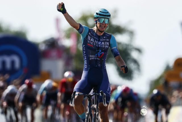 Bahrain - Victorious Belgian rider Alec Segaert celebrates as he crosses the finish line to win the 12th stage of the Giro d'Italia 2026 - Tour of Italy cycling race between Imperia and Novi Ligure, Italy, on May 21, 2026. (Photo by Luca Bettini / AFP)