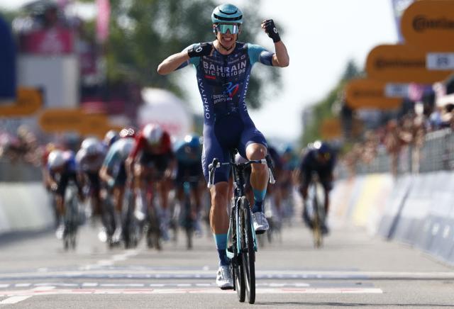 Bahrain - Victorious Belgian rider Alec Segaert celebrates as he crosses the finish line to win the 12th stage of the Giro d'Italia 2026 - Tour of Italy cycling race between Imperia and Novi Ligure, Italy, on May 21, 2026. (Photo by Luca Bettini / AFP)