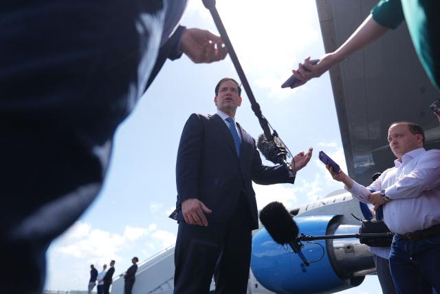 US Secretary of State Marco Rubio speaks to the press before boarding his plane at Homestead Air Reserve Base on May 21, 2026 in Homestead, Florida. Rubio is traveling to a NATO foreign ministers meeting in Sweden. (Photo by Julia Demaree Nikhinson / POOL / AFP)