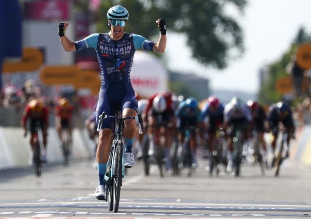 Bahrain - Victorious Belgian rider Alec Segaert celebrates as he crosses the finish line to win the 12th stage of the Giro d'Italia 2026 - Tour of Italy cycling race between Imperia and Novi Ligure, Italy, on May 21, 2026. (Photo by Luca Bettini / AFP)