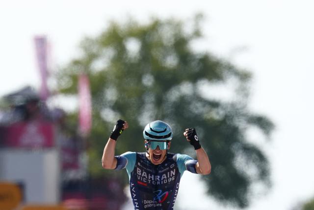 Bahrain - Victorious Belgian rider Alec Segaert celebrates as he crosses the finish line to win the 12th stage of the Giro d'Italia 2026 - Tour of Italy cycling race between Imperia and Novi Ligure, Italy, on May 21, 2026. (Photo by Luca Bettini / AFP)