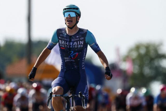 Bahrain - Victorious Belgian rider Alec Segaert celebrates as he crosses the finish line to win the 12th stage of the Giro d'Italia 2026 - Tour of Italy cycling race between Imperia and Novi Ligure, Italy, on May 21, 2026. (Photo by Luca Bettini / AFP)