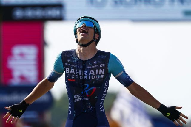 Bahrain - Victorious Belgian rider Alec Segaert celebrates as he crosses the finish line to win the 12th stage of the Giro d'Italia 2026 - Tour of Italy cycling race between Imperia and Novi Ligure, Italy, on May 21, 2026. (Photo by Luca Bettini / AFP)