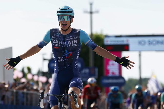 Bahrain - Victorious Belgian rider Alec Segaert celebrates as he crosses the finish line to win the 12th stage of the Giro d'Italia 2026 - Tour of Italy cycling race between Imperia and Novi Ligure, Italy, on May 21, 2026. (Photo by Luca Bettini / AFP)
