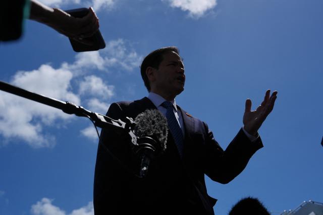 US Secretary of State Marco Rubio speaks to the press before boarding his plane at Homestead Air Reserve Base on May 21, 2026 in Homestead, Florida. Rubio is traveling to a NATO foreign ministers meeting in Sweden. (Photo by Julia Demaree Nikhinson / POOL / AFP)