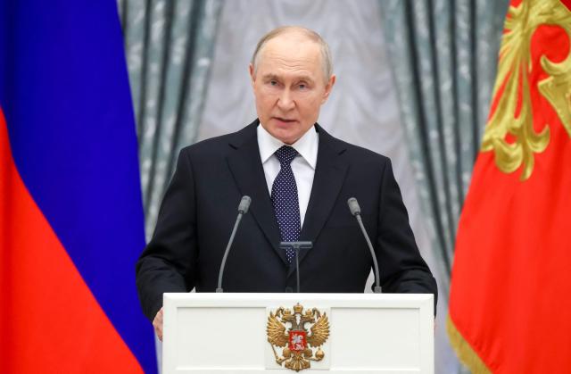In this pool photograph distributed by the Russian state agency Sputnik, Russia's President Vladimir Putin gives a speech during a state awards ceremony at the Kremlin in Moscow on May 21, 2026. (Photo by Vyacheslav PROKOFYEV / POOL / AFP)