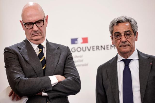 France's Economy, Finances and Industry Minister Roland Lescure (L) and France's Trade Minister Serge Papin (R) attend a press conference focusing on the consequences of the war in Iran and to announce "measures to support economic activity", at the Hotel Matignon Prime minister residence in Paris on May 21, 2026. (Photo by STEPHANE DE SAKUTIN / AFP)